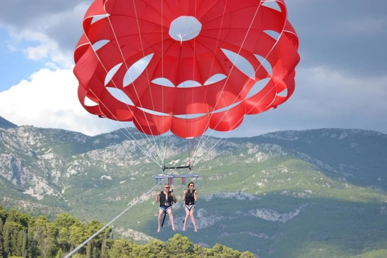 Parasailing flight above the Montenegro sea as a short beach-water activity option